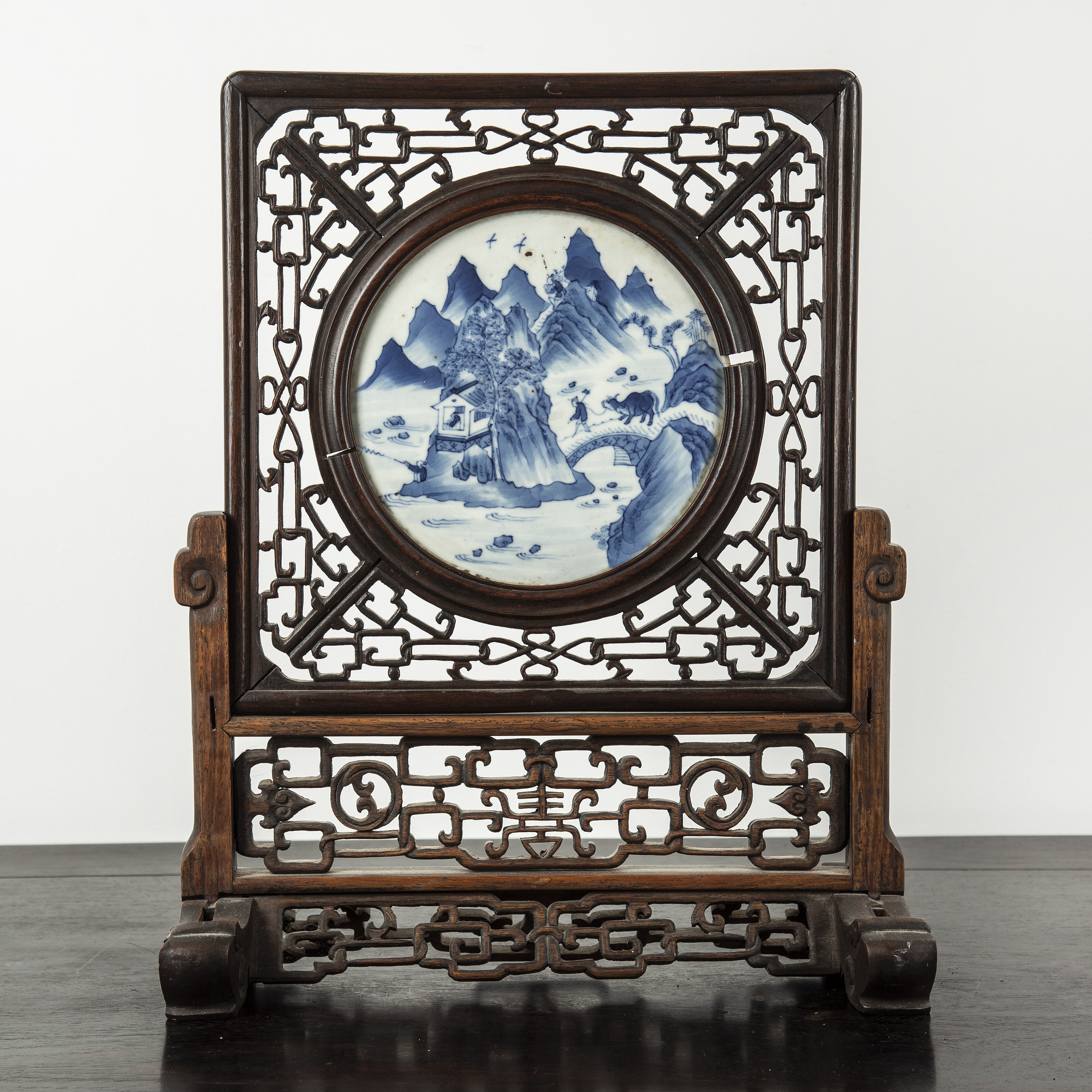 Appraisal: Circular blue and white porcelain and hardwood table screenChinese th