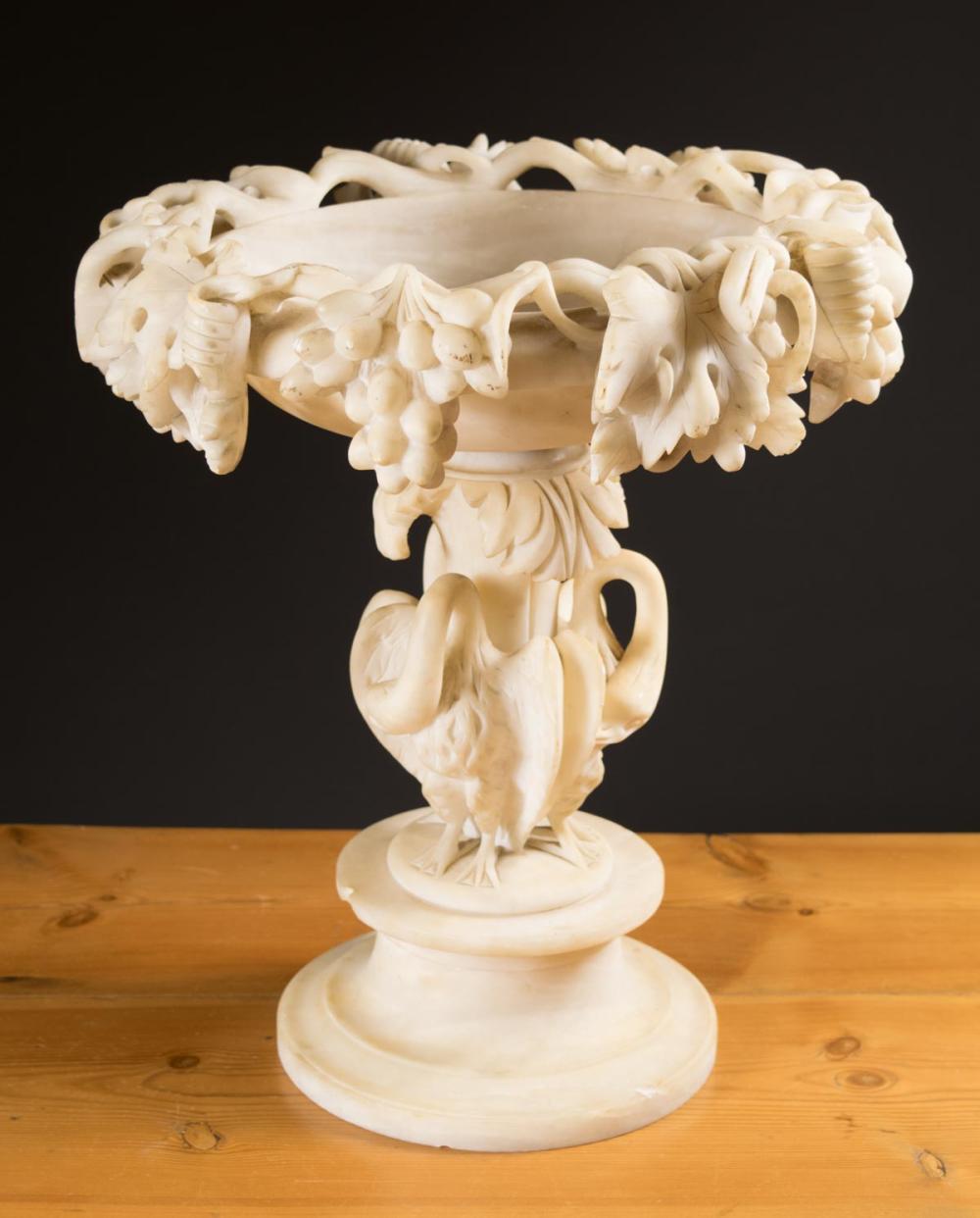 Appraisal: CARVED ALABASTER PEDESTAL CENTERPIECE BOWL the circular base featuring three