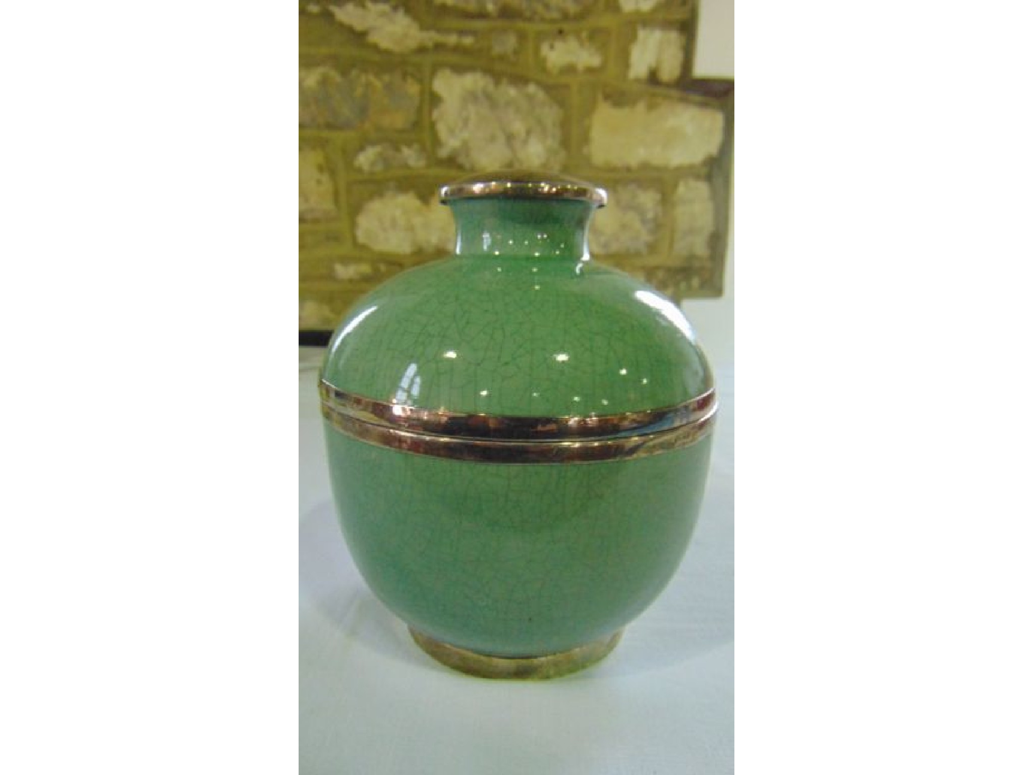 Appraisal: An oriental bowl and cover with crackle glazed celadon type