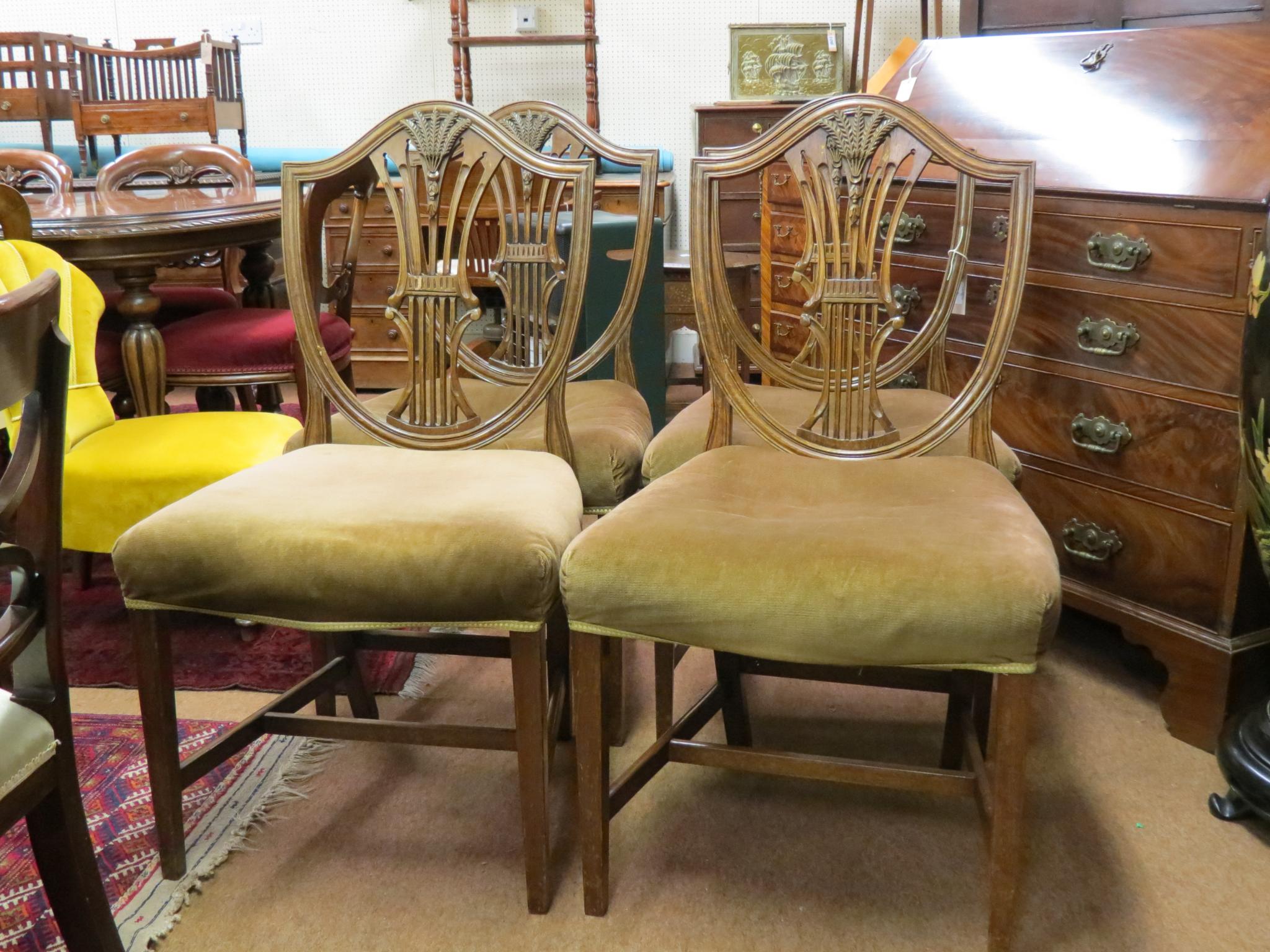 Appraisal: A set of four Victorian Hepplewhite mahogany dining chairs shield-shape