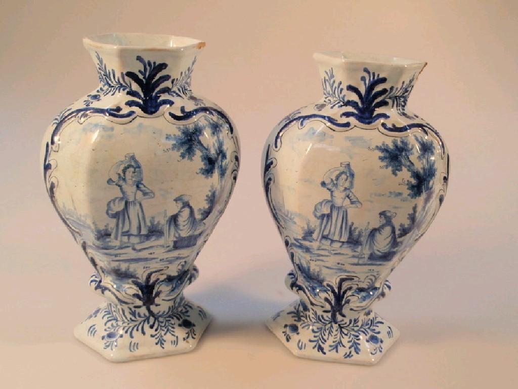 Appraisal: Two Delft blue and white baluster vases tapering hexagonal form