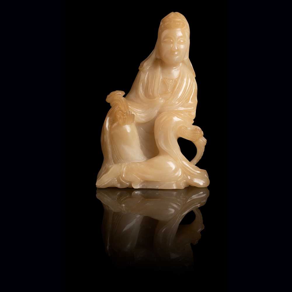 Appraisal: PALE YELLOW SOAPSTONE CARVING OF A SEATED GUANYIN QING DYNASTY