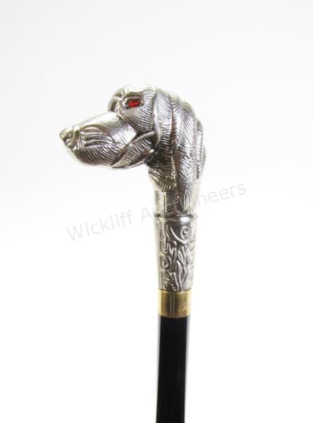 Appraisal: Dog Head Sword Cane solid ebony shaft topped with dog