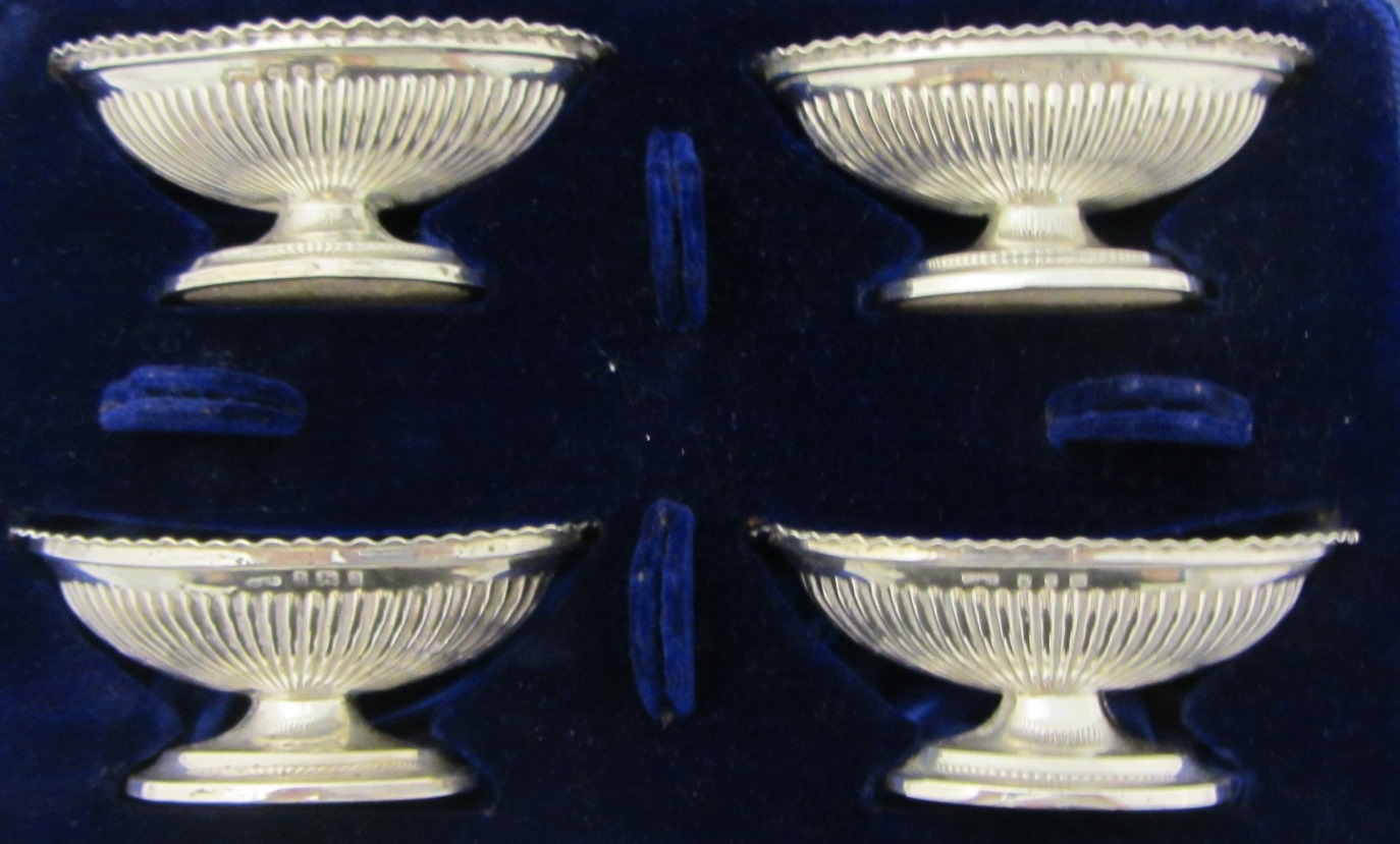 Appraisal: Four silver boat shaped salts each with partly fluted decoration