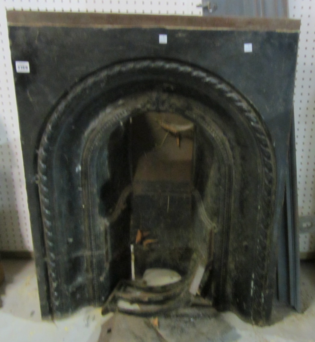 Appraisal: A cast iron arch top fireplace