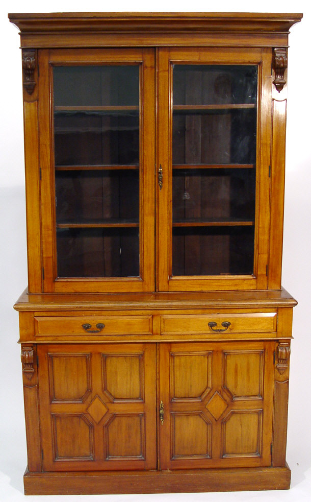 Appraisal: Victorian walnut bookcase the moulded cornice above a pair of