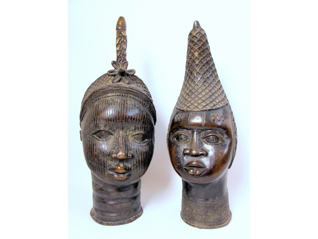 Appraisal: A pair of Benin bronze heads of the Oba and