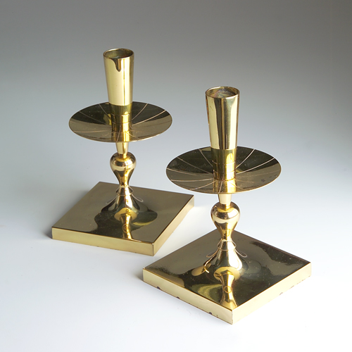 Appraisal: TOMMI PARZINGER DORLYN SILVERSMITHS Pair of polished brass candlesticks with