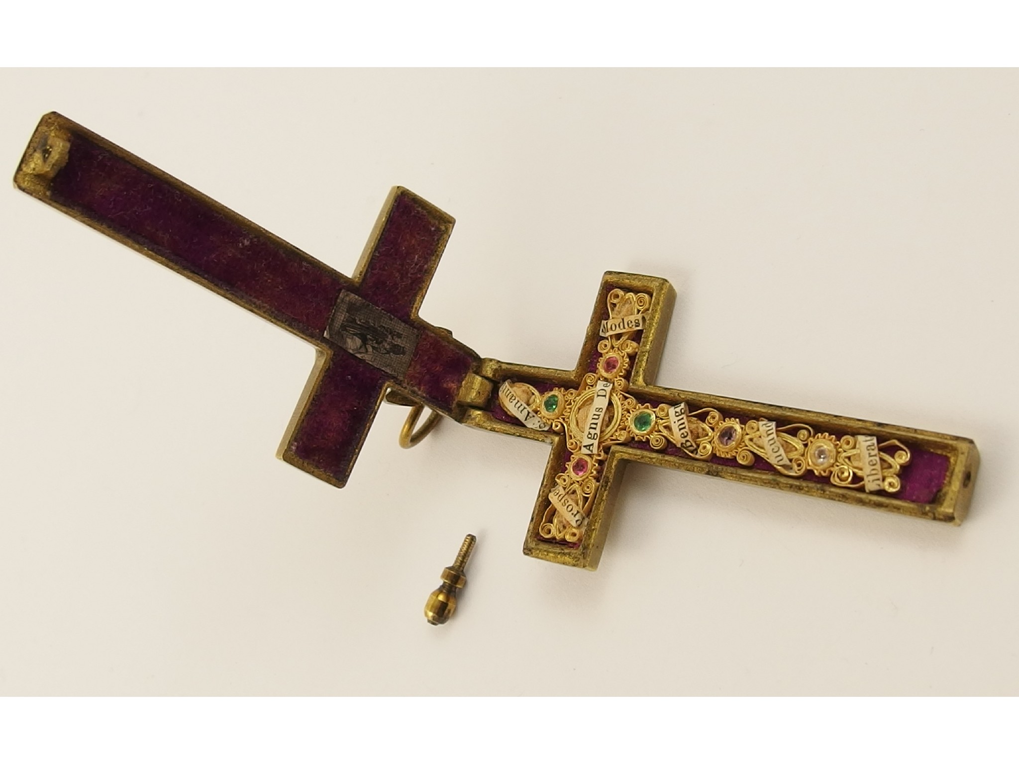 Appraisal: A brass crucifix with a hidden yellow metal filigree and