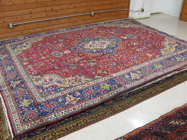 Appraisal: PERSIAN TABRIZ CARPET floral and central floral medallion design on