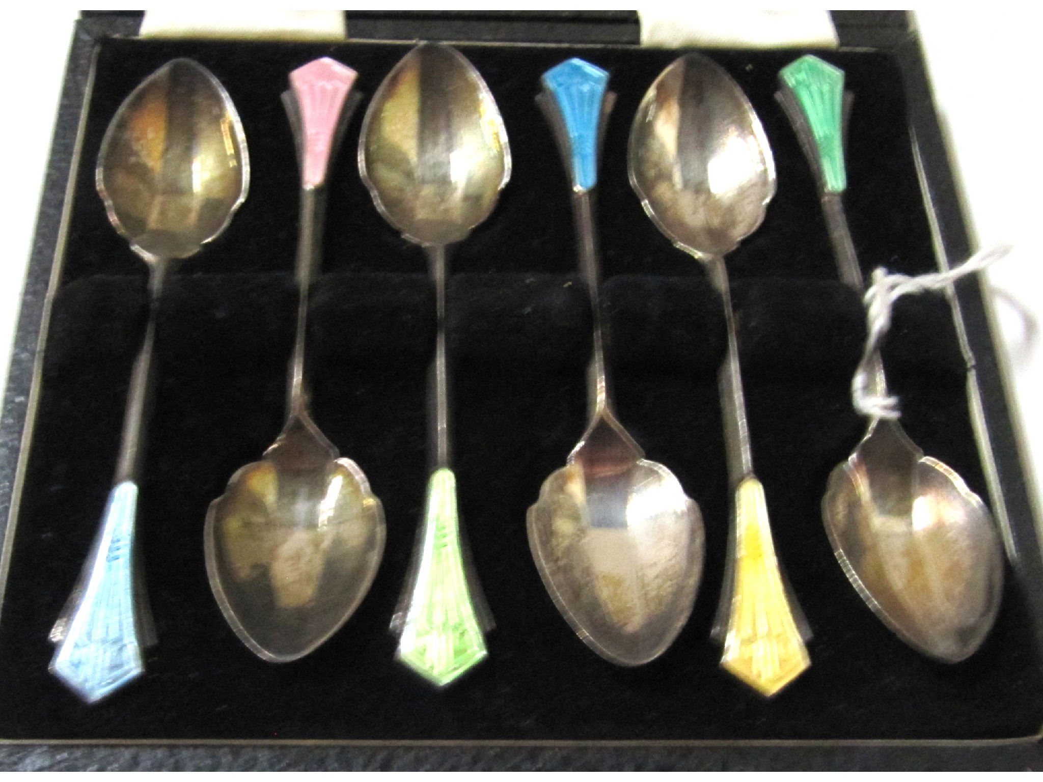 Appraisal: A cased set of six silver and enamel coffee spoons