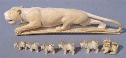 Appraisal: Ivory model of a tiger th century Together with six