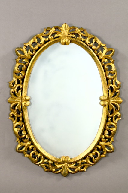 Appraisal: Italian Carved Giltwood Oval Looking Glass in the rococo taste