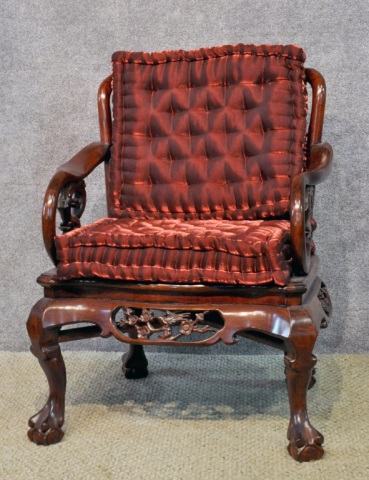 Appraisal: Chinese Style Carved Arm ChairWith naturalistic carving and burgundy cushions