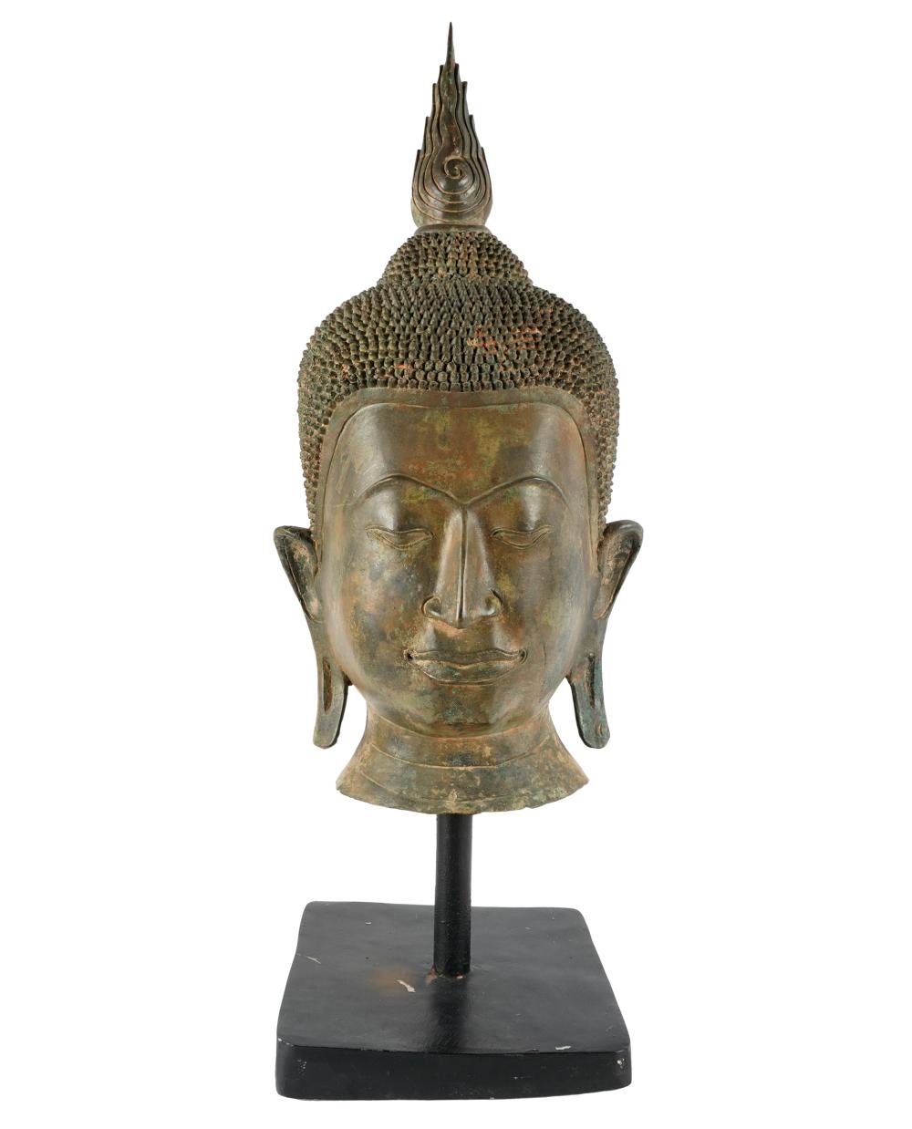 Appraisal: THAI HEAD OF BUDDHAbronze mounted on wooden stand inches high