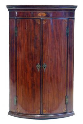 Appraisal: A GEORGE III MAHOGANY CORNER CUPBOARD of quadrant form with