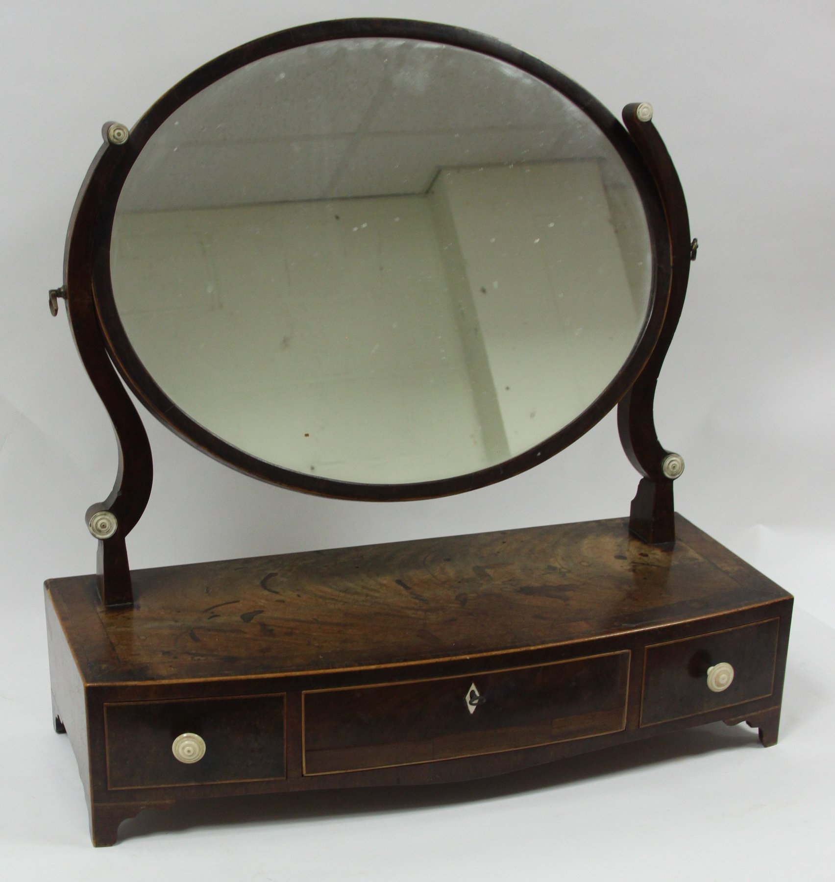 Appraisal: A th Century swing-frame toilet mirror the oval plate on