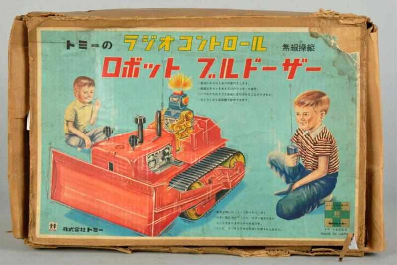 Appraisal: Scarce Robot Bulldozer Battery-Operated Toy Description Japanese Made by Tomy