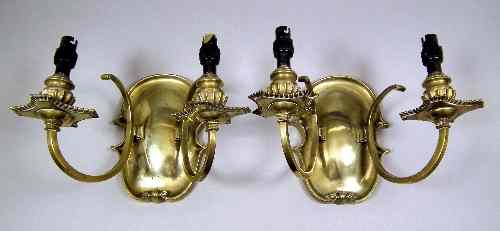 Appraisal: A pair of th Century brass two light wall sconces