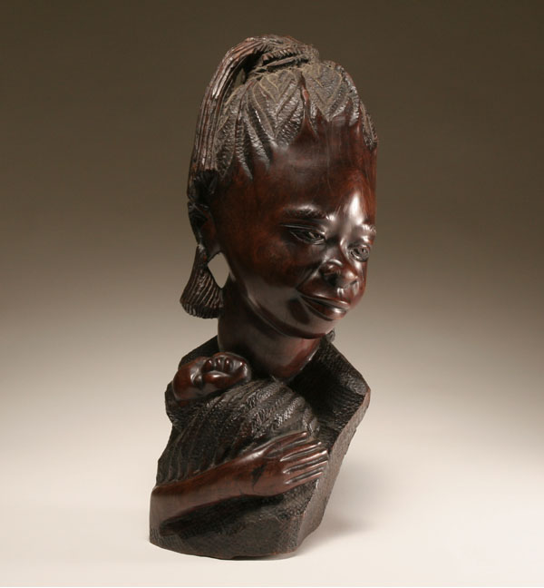 Appraisal: African carved wooden sculpture of mother and child A mother