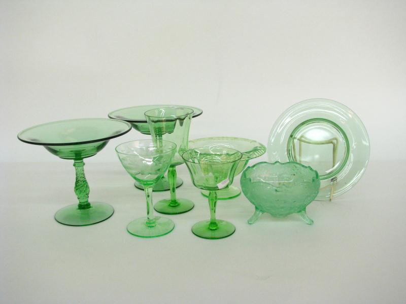 Appraisal: Collection of transparent green depression-era glassware including two pedestal compotes