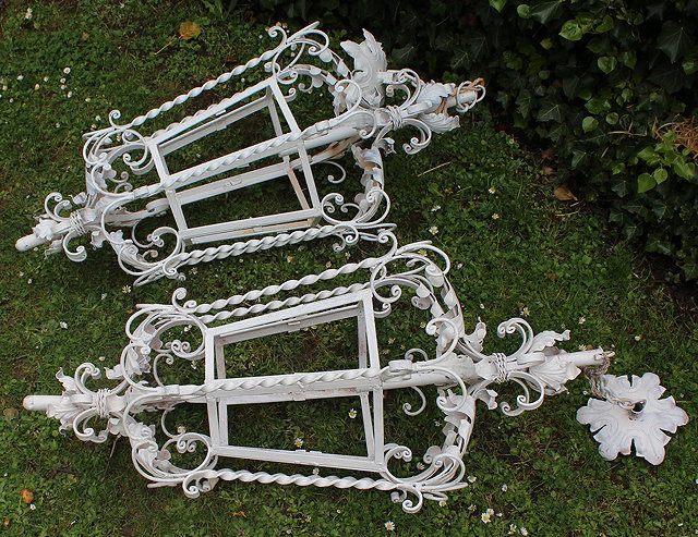 Appraisal: A PAIR OF WHITE PAINTED WROUGHT IRON LANTERNS with scroll