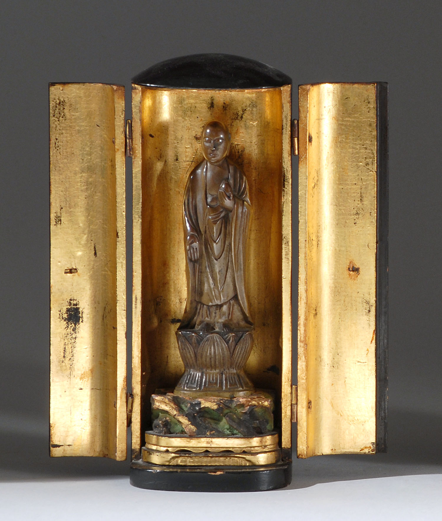 Appraisal: BLACK LACQUER BUTSUDAN WITH BRONZE BUDDHA FIGURE th CenturyWith standing