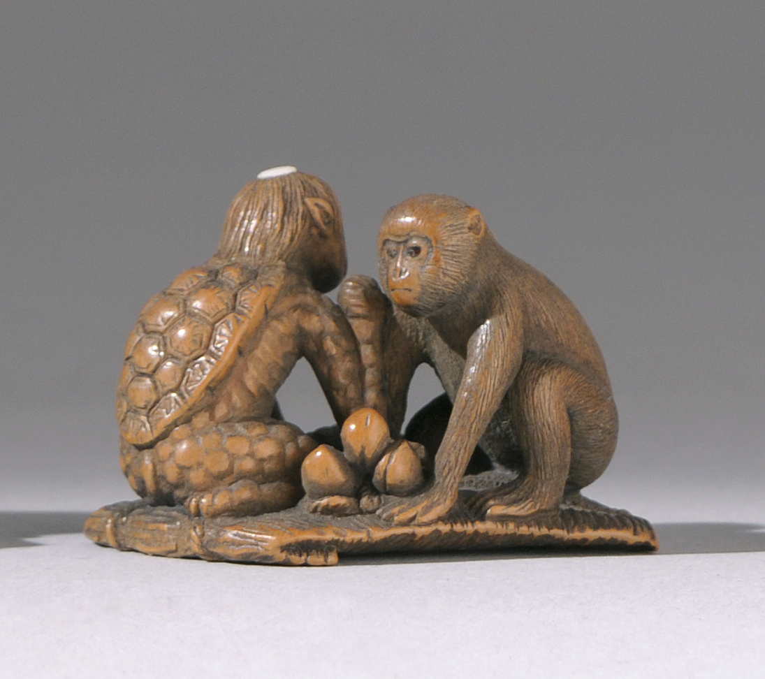 Appraisal: INLAID WOOD NETSUKE Meiji PeriodBy Tamekazu Depicting a kappa with