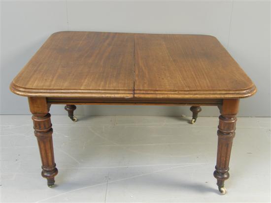 Appraisal: th century mahogany dining table on turned reeded tapering legs