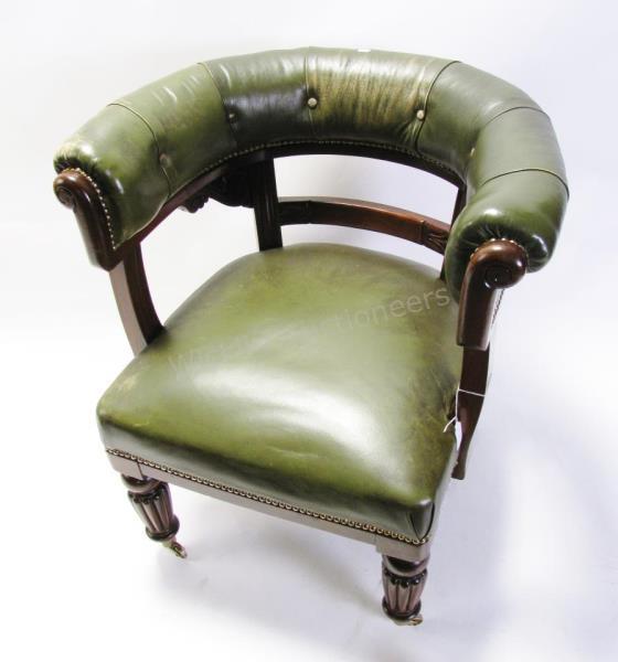 Appraisal: A period-style mahogany arm chair horseshoe design carved frame with