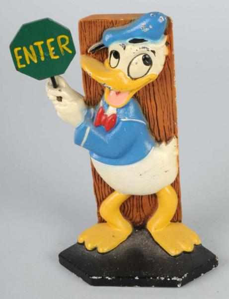 Appraisal: Cast Iron Donald Duck with Stop Sign Doorstop Description Walt