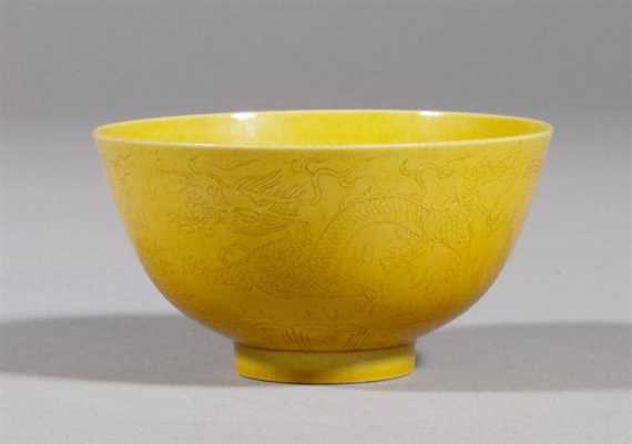 Appraisal: YELLOW GLAZED BOWL WITH INCISED DRAGONS AND PHOENIXES China Tongzh