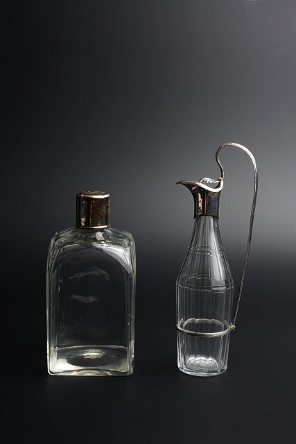 Appraisal: A GEORGIAN GLASS CRUET BOTTLE of faceted form with silver