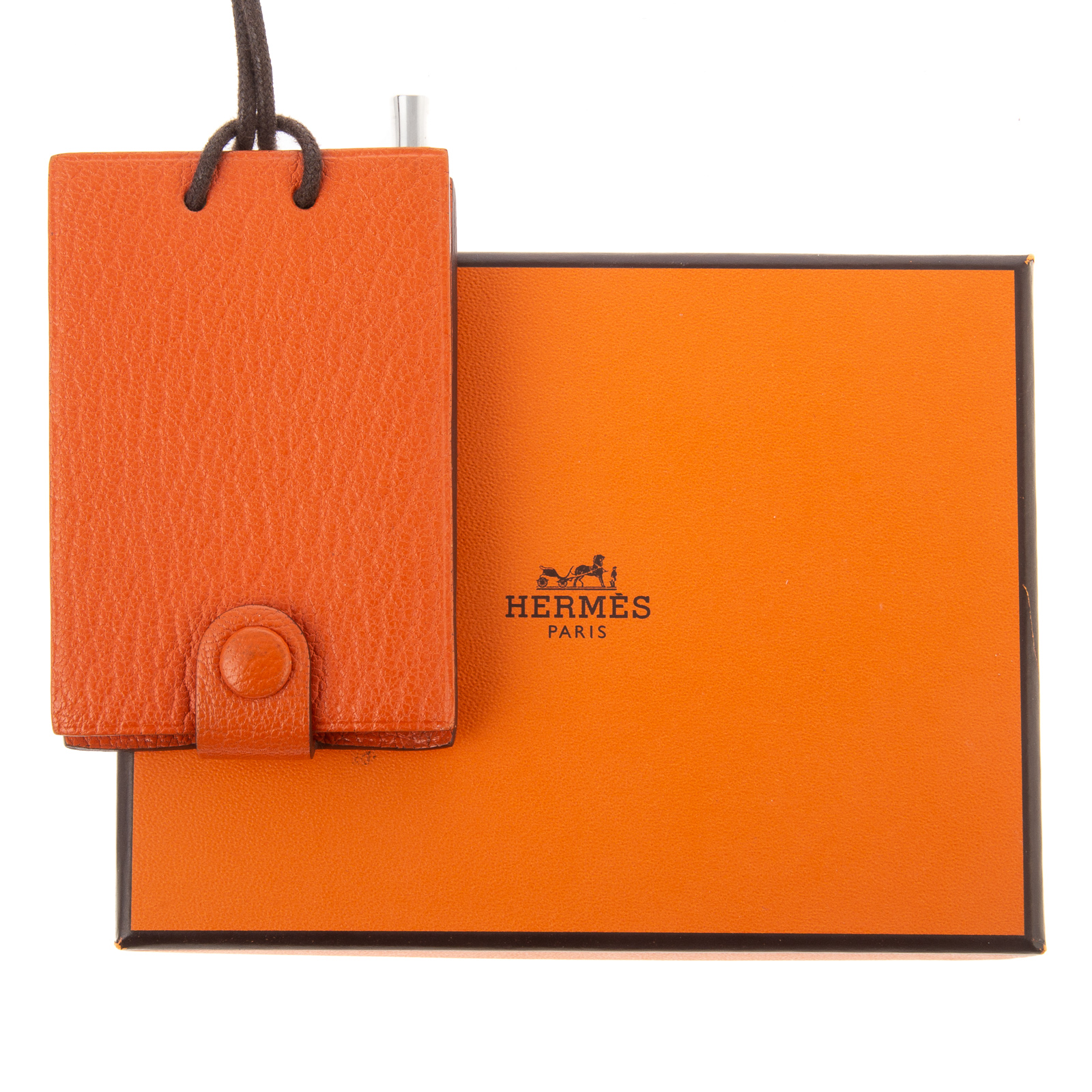 Appraisal: AN HERMES CHEVRE MYSORE NOTEPAD NECKLACE An orange leather Hermes