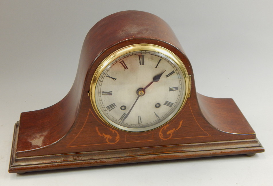 Appraisal: An Edwardian marquetry mantel clock with silvered dial on bun