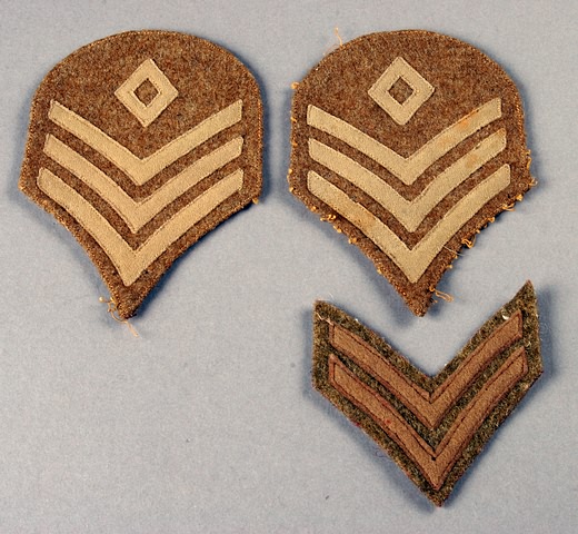 Appraisal: Pair of sergeants insignia and corporal insignia