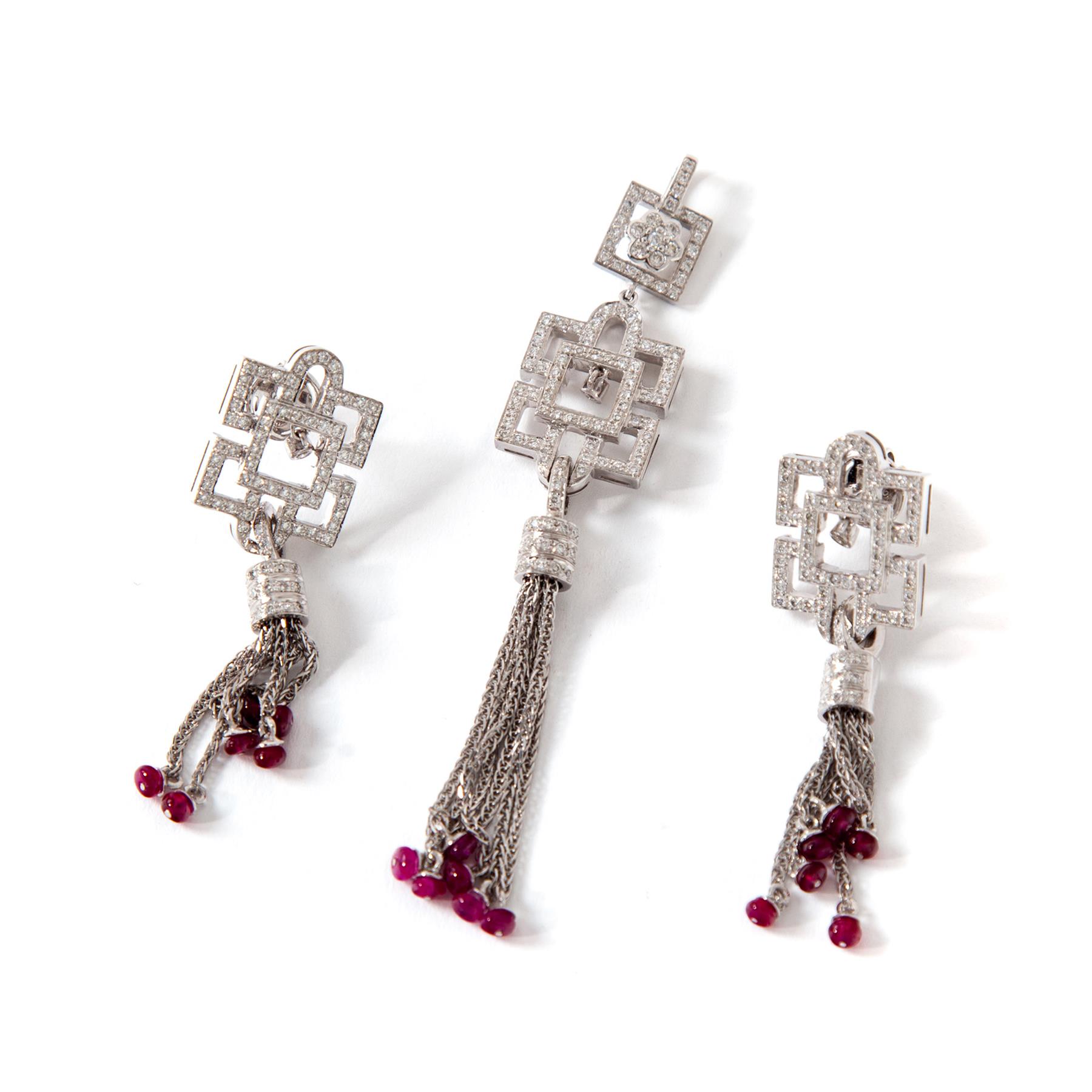 Appraisal: DIAMOND AND RUBY DECO-STYLE EARRINGS PENDANT American st century KWG