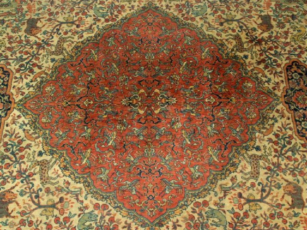 Appraisal: HUNTING CARPET OF TABRIZ TYPE the central medallion with brick