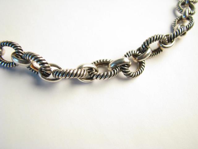 Appraisal: A sterling silver heavy designer link chain with toggle clasp