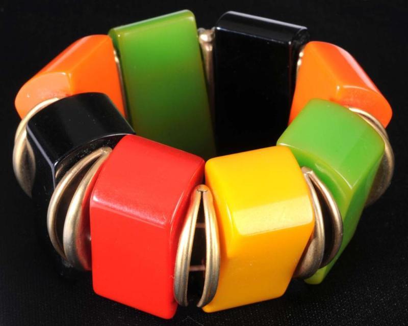 Appraisal: Bakelite Brass Stretch Bracelet Description Four colors of Bakelite Will