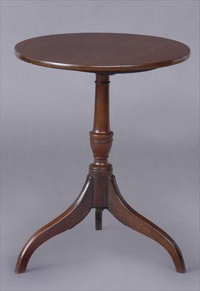 Appraisal: GEORGE III MAHOGANY TRIPOD CANDLESTAND The plain circular tilt-top on