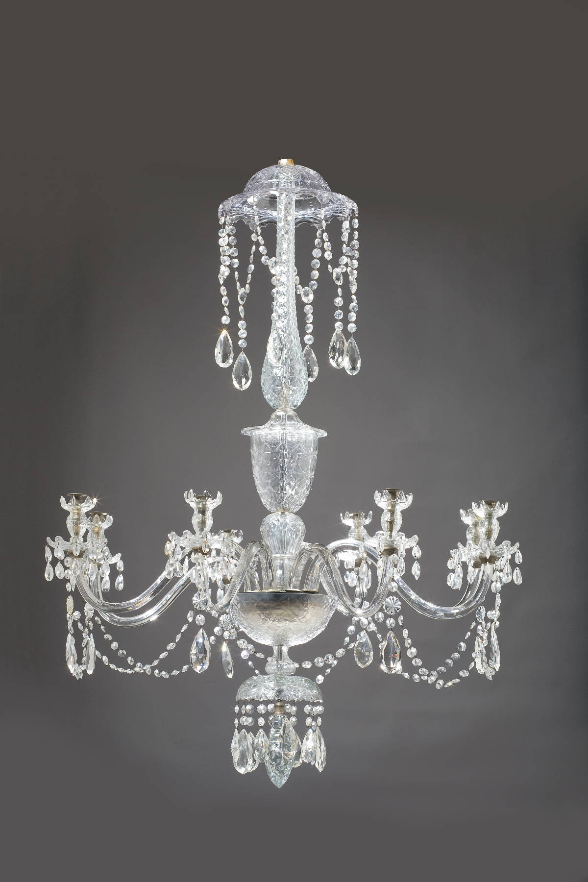 Appraisal: GEORGE III STYLE CUT-GLASS EIGHT-LIGHT CHANDELIER The corona hung with