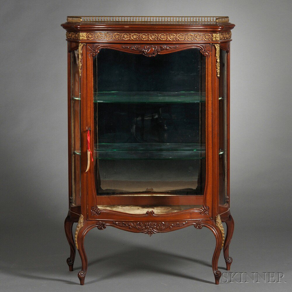 Appraisal: Louis XV XVI-style Mahogany Parcel-gilt and Brass-mounted Vitrine Cabinet early