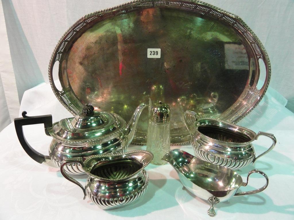 Appraisal: A silver plated oval gallery tray together with a three