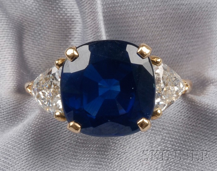 Appraisal: kt Gold Sapphire and Diamond Ring prong-set with a cushion-cut