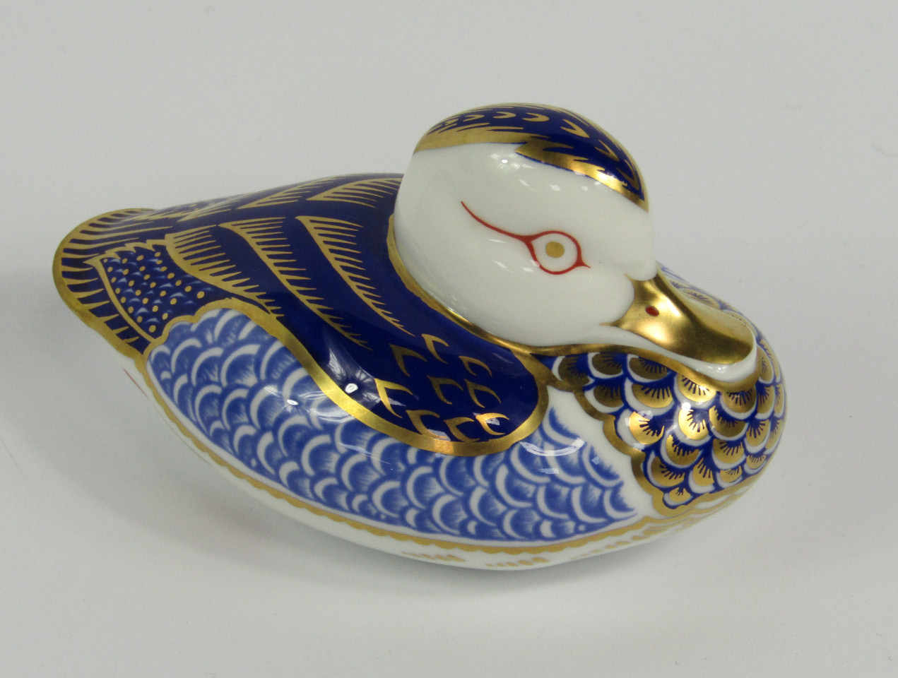 Appraisal: A Royal Crown Derby Imari porcelain paperweight modelled as the