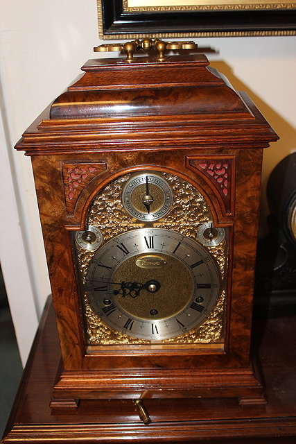 Appraisal: A GEORGIAN STYLE BURR WALNUT CASED TABLE CLOCK with carrying