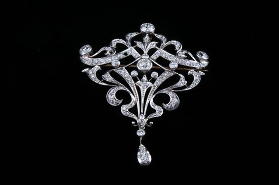 Appraisal: EDWARDIAN PLATINUM-ON-YELLOW GOLD AND DIAMOND OPENWORK CARTOUCHE SHAPE BROOCH Early