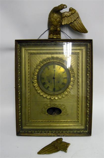 Appraisal: Classical gilt square case wall clockWith a molded eagle finial