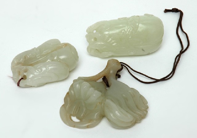 Appraisal: A GROUP OF THREE CHINESE JADE CARVINGS th th Century